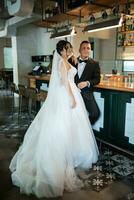 bride and groom inside a cocktail bar photo