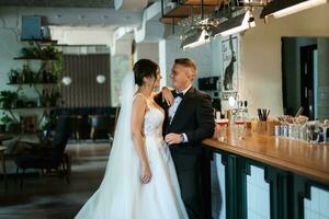 bride and groom inside a cocktail bar photo