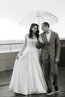 bride and groom first meeting on the roof of skyscraper photo