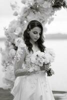 bride against the background of a yellow sunset photo