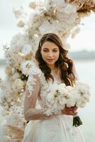 bride against the background of a yellow sunset photo