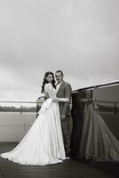 bride and groom first meeting on the roof of skyscraper photo