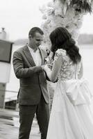 wedding ceremony of the newlyweds on the pier photo