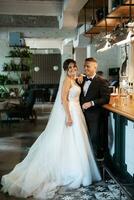 bride and groom inside a cocktail bar photo