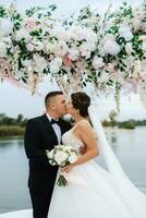 wedding ceremony of the newlyweds on the pier photo