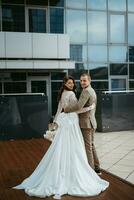 bride and groom first meeting on the roof of skyscraper photo