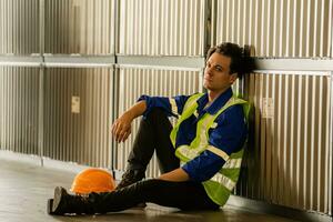 Caucasian shipping warehouse workers look tired, sad, and depressed. photo