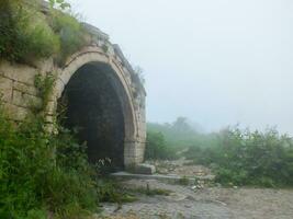 Santa Ruins in foggy weather, Gumushane, Turkey. photo