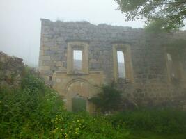 Old Church in Santa Ruins, Gumushane, Turkey. Santa Ruins in foggy weather. photo