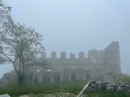 Santa Ruins in foggy weather. Old Church in Santa Ruins, Gumushane, Turkey. photo