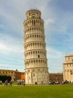 The famous leaning tower of Pisa in Tuscany, Italy. Pisa tower in Piazza dei Miracoli. Italy - July 18, 2013. Selective focus and noise included. photo