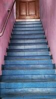 staircase in the old house, close up of blue stairs photo