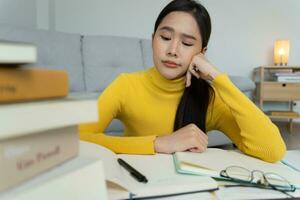 Asian student woman have anxiety because of exams, female prepare for test and learning lessons in the library. stress, despair, haste, misunderstanding reading, discouraged, expectation, knowledge photo