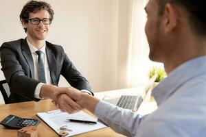 lease, rental and selling home. Dealership manager smile handshake to the new homeowner. rent house, Sales, loan credit financial, insurance, Seller, dealer, installment photo