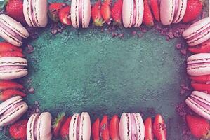 Homemade cake with strawberries and macaroons cookies, copyspace photo