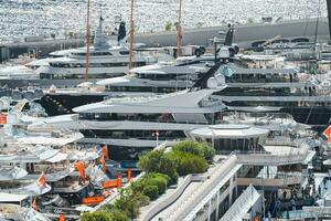 Monaco, Monte Carlo, 27 September 2022 - a lot of luxury yachts at the famous motorboat exhibition in the principality, the most expensive boats for the richest people around the world, yacht brokers photo