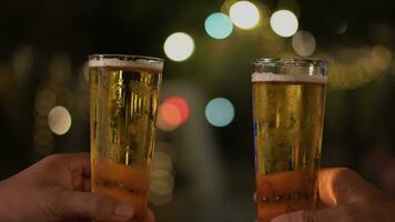 Close-up of drinking beer Or clinking beer glasses video