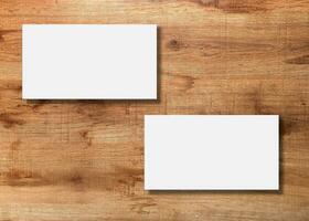 Blank business card presentation on wooden background photo