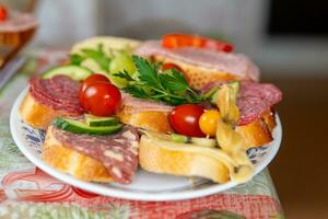 a mixture of sandwiches with fruit photo