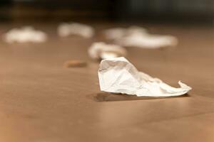 paper litter on a footpath photo