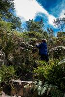 Young woman exploring the nature of a beautiful paramo at the department of Cundinamarca in Colombia photo