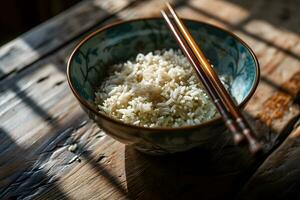 AI generated Rice in a bowl with chopsticks on a wooden table photo