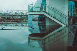 Stairs by the water with reflection photo