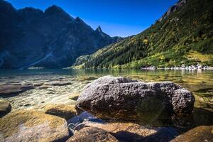 Landscape of mountain lake Morskie Oko near Zakopane, Tatra Mountains, Poland photo