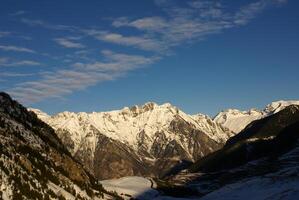 panoramic view, south side, of massif of Maladeta in the Pyrenees photo