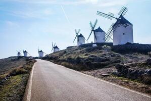 Cervantes Don Quixote windmills and Consuegra castle. Castile La Mancha, Spain photo