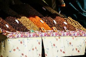 Dried fruits and legumes at a market stall in Morocco photo