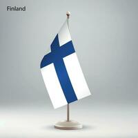 Flag of Finland hanging on a flag stand. vector
