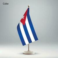 Flag of Cuba hanging on a flag stand. vector