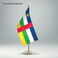 Flag of Central African Republic hanging on a flag stand. vector