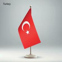 Flag of Turkey hanging on a flag stand. vector