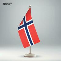 Flag of Norway hanging on a flag stand. vector