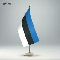 Flag of Estonia hanging on a flag stand. vector