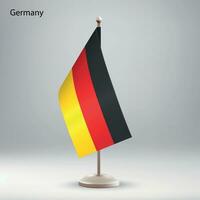 Flag of Germany hanging on a flag stand. vector