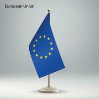 Flag of European Union hanging on a flag stand. vector