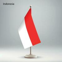 Flag of Indonesia hanging on a flag stand. vector