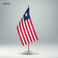 Flag of Liberia hanging on a flag stand. vector