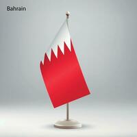 Flag of Bahrain hanging on a flag stand. vector