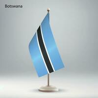 Flag of Botswana hanging on a flag stand. vector