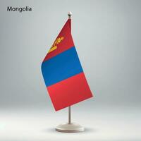 Flag of Mongolia hanging on a flag stand. vector