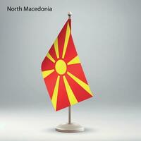 Flag of North Macedonia hanging on a flag stand. vector