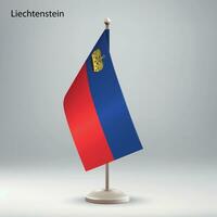 Flag of Liechtenstein hanging on a flag stand. vector