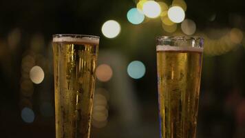 Close-up of drinking beer Or clinking beer glasses photo