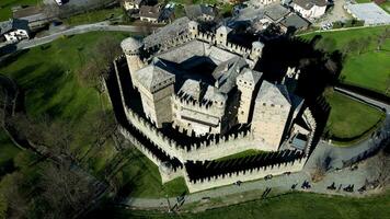 Aerial view of Fenis castle Valle d'Aosta Italy shot with rotation view from top to bottom video