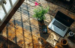 AI generated top view of office desk with laptop, calculator and paper, copy space photo