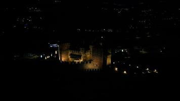 Rotating night aerial view of Fenis castle Aosta Valley Italy video